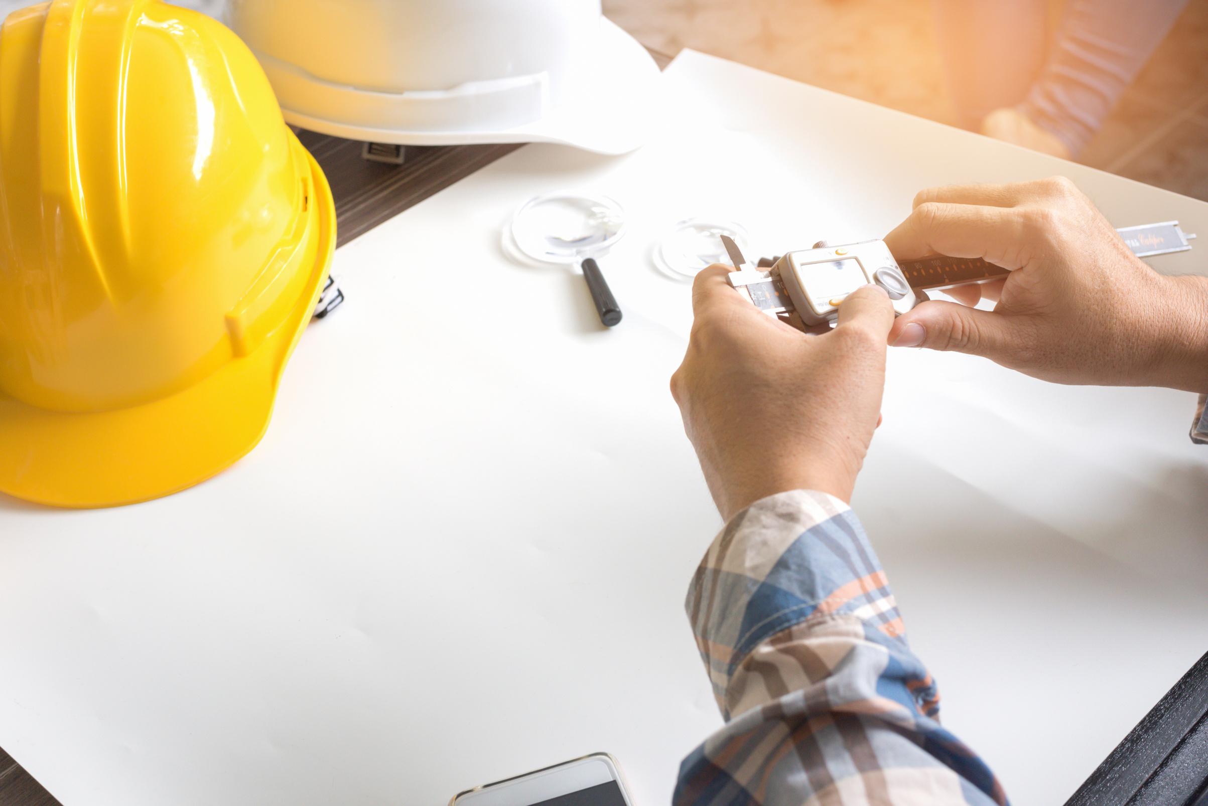 Construction Engineer Measuring with Vernier Caliper. Business a